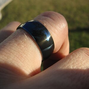 Cobalt blue MP35N wedding-band style ring in the Florida sun.