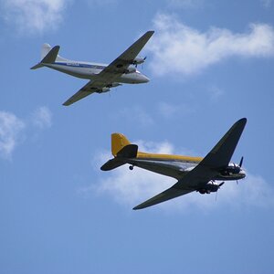 DC-3 in formation with one of two remaining airworthy DH 114 Heron.