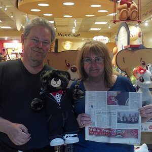 Hershal, Laura, and Camo, at Build_A_Bear, with newspaper showing story for giving bears