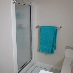The shower didn't have a door - we took a lot of care to fit this door into a shower with crooked walls.